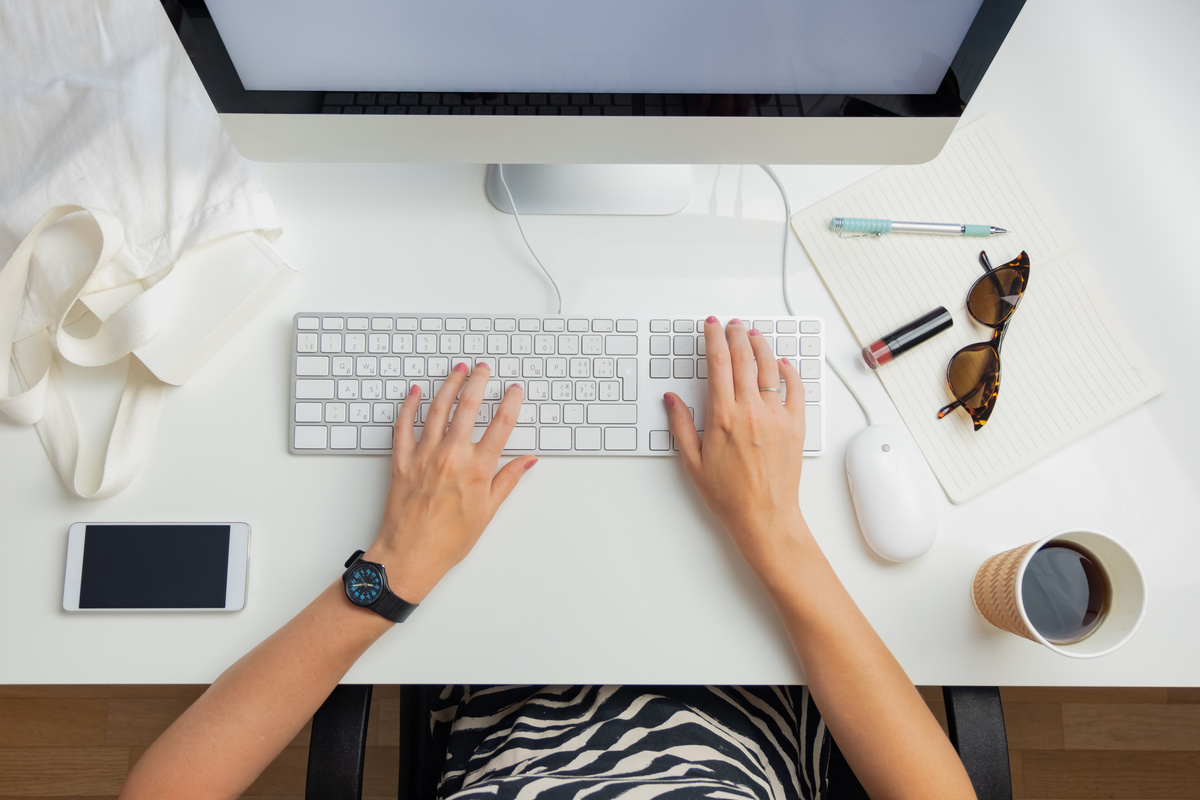 Woman Working on the Desktop Computer